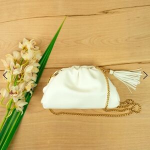 NWOT UNDERSTATED LEATHER Crescent White Clutch/ Dust bag Included